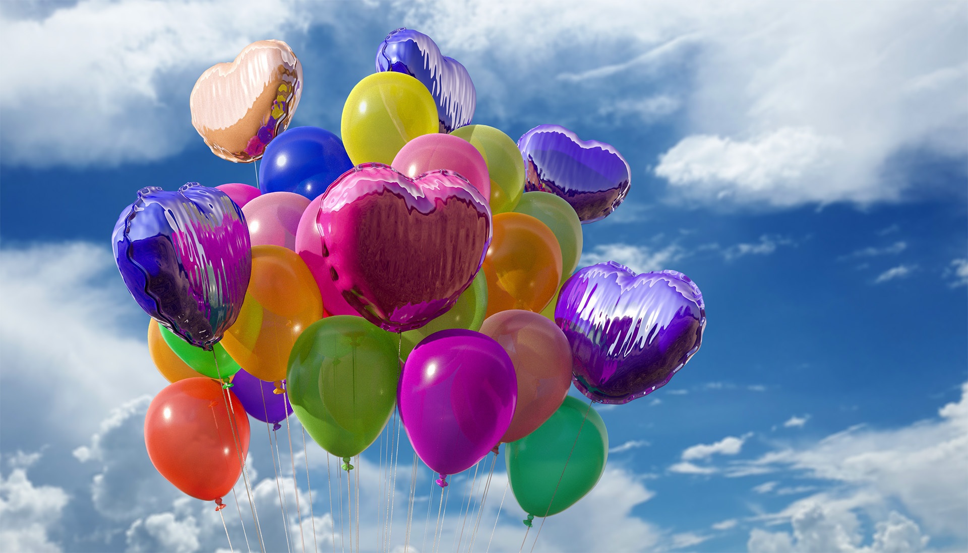 Balloon bouquet with clouds in background