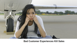 Unhappy woman sitting on tarmac by airplane