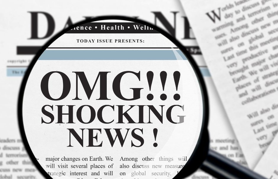 Newspaper with headline about shocking news